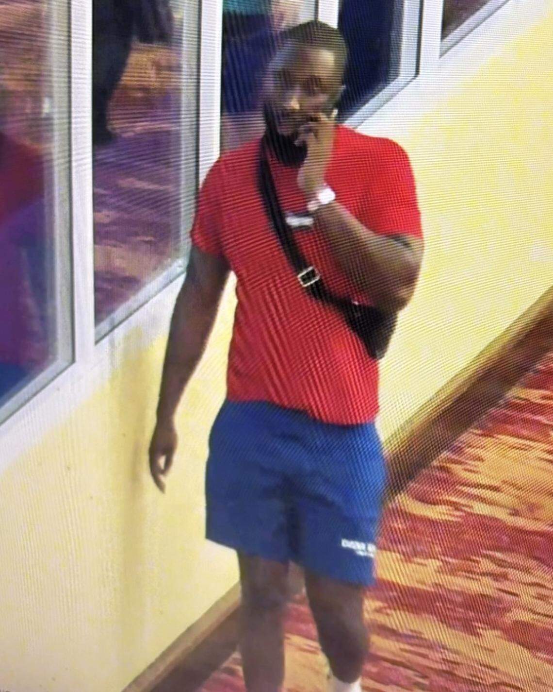 A man in a red T-shirt and blue shorts is seen talking on a phone at the Seminole Hard Rock & Casino near Hollywood on Monday, April 6, 2026. The rapper Offset was shot that night.